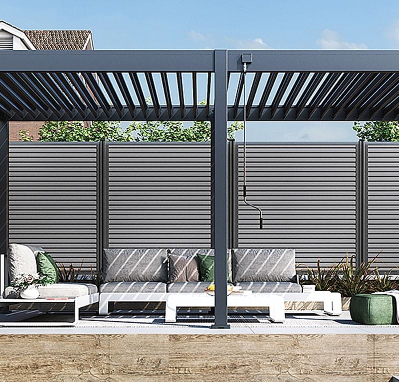 NEO STEEL manual louvered pergola with steel louvres in a backyard garden