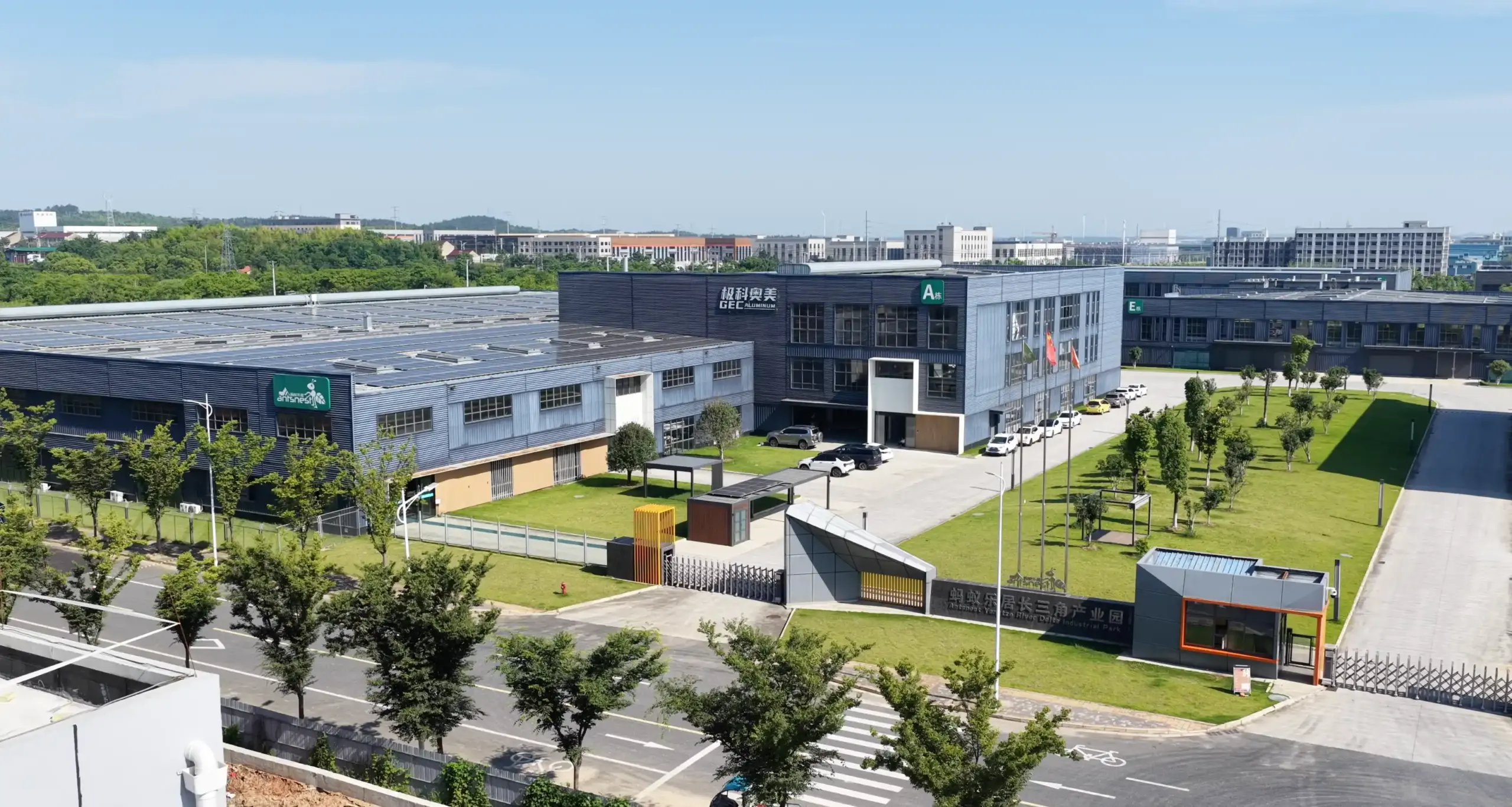 Outdoor Creation aluminum pergola manufacturing facility with modern factory buildings and outdoor product production capacity