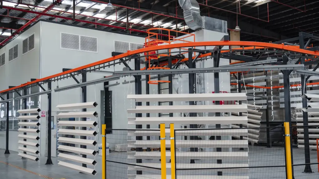 Outdoor Creation aluminum pergola manufacturing facility with powder coating line and louvered roof components